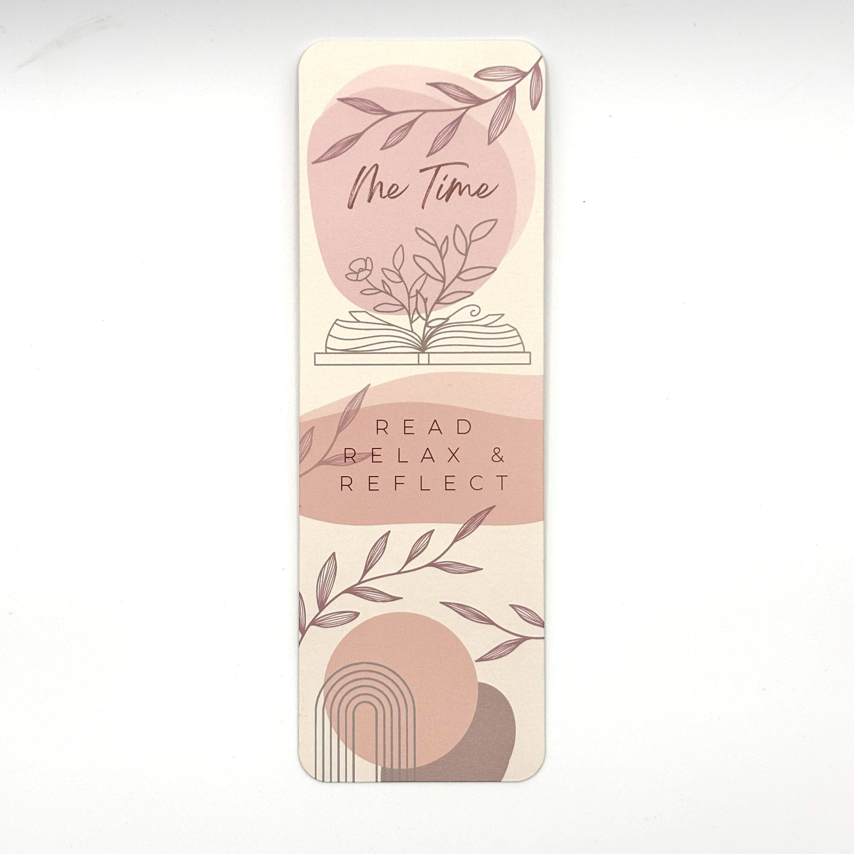 Bookmark with greenery and abstract illustrations and motivational quote "read relax & reflect"