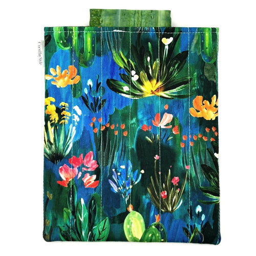 E-Reader sleeve with colorful floral and plant pattern on a blue background