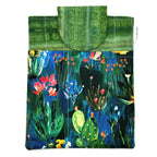 E-Reader sleeve with colorful floral and plant pattern on a blue background
