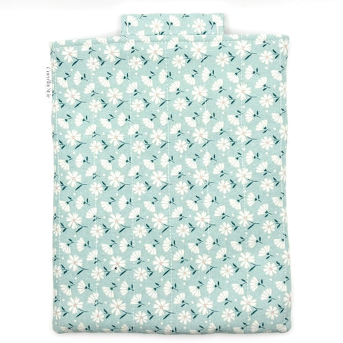 E-Reader sleeve with floral patterned fabric on a light blue background