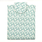 E-Reader sleeve with floral patterned fabric on a light blue background