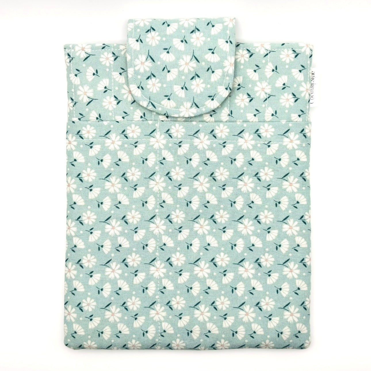 E-Reader sleeve with floral patterned fabric on a light blue background