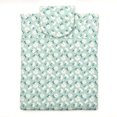 E-Reader sleeve with floral patterned fabric on a light blue background