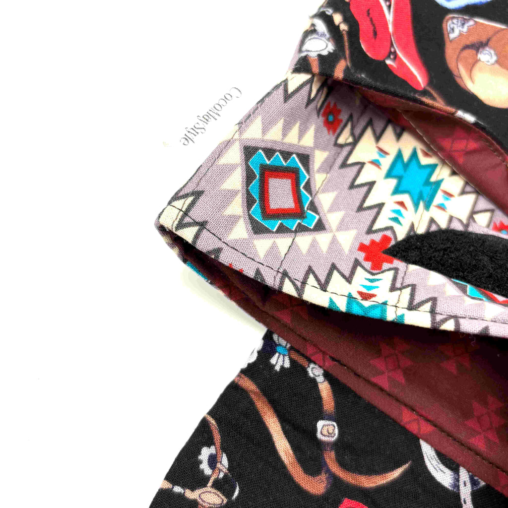 Close-up of e-Reader sleeve with cowboy-themed design including hats, boots, and ropes