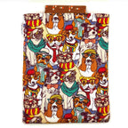 E-Reader sleeve with patterned dogs wearing hats, glasses, and scarves