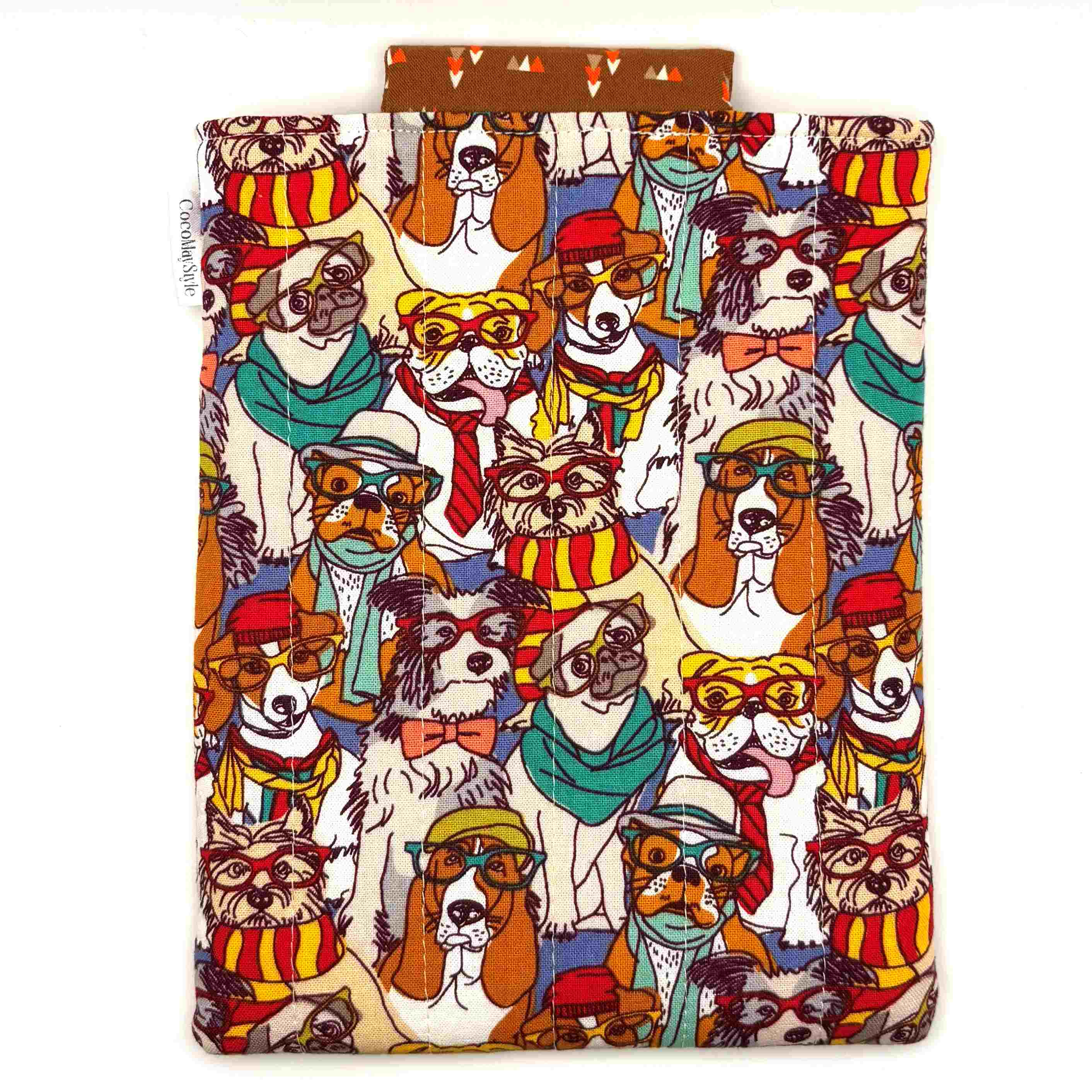 E-Reader sleeve with patterned dogs wearing hats, glasses, and scarves