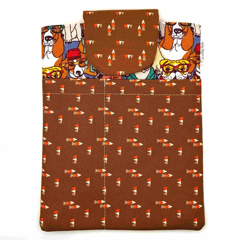 E-Reader sleeve with patterned dogs wearing hats, glasses, and scarves