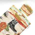 E-Reader sleeve with cowboy boot and hat design showing open velcro flap