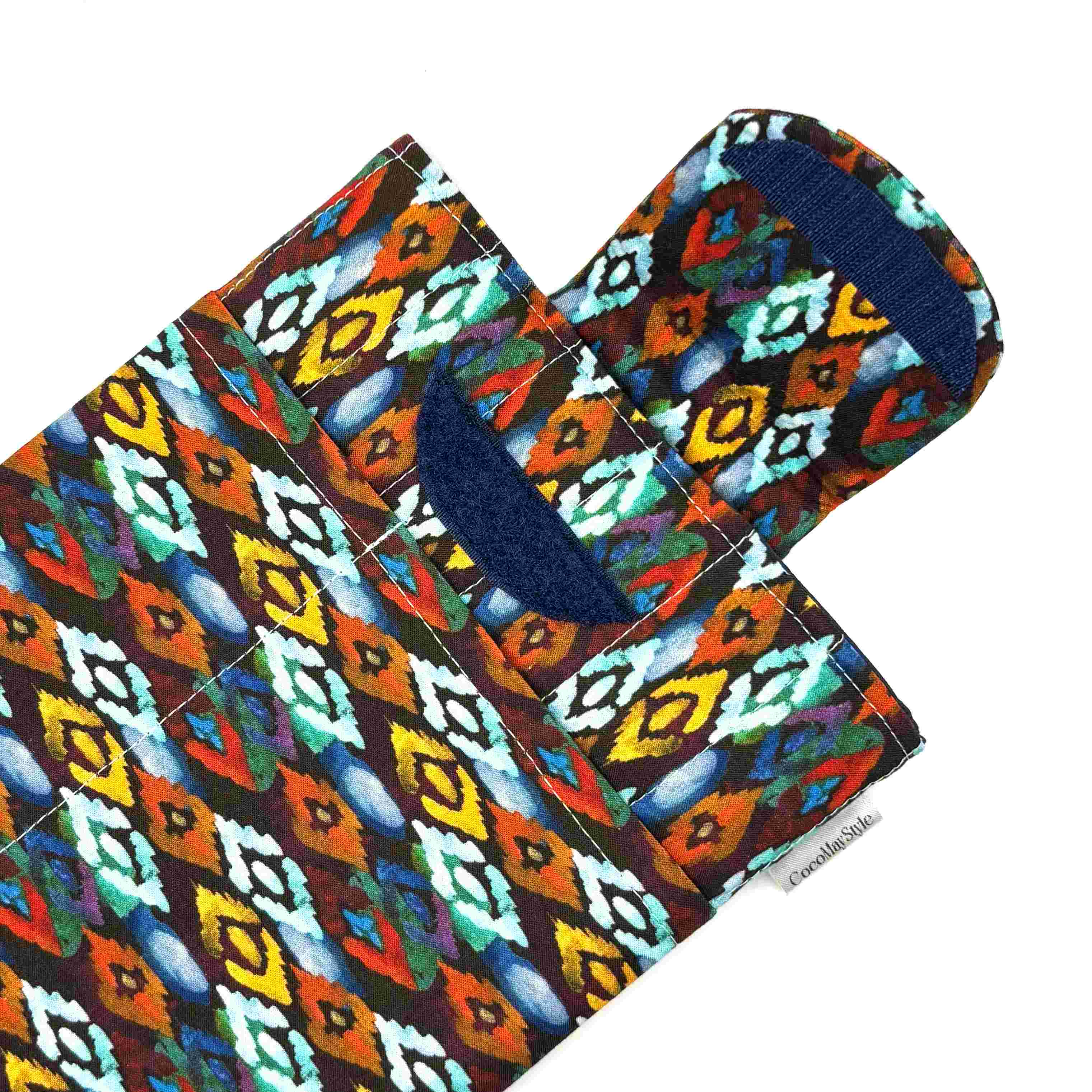 E-Reader sleeve with colorful diamond patterned fabric showing open velcro flap
