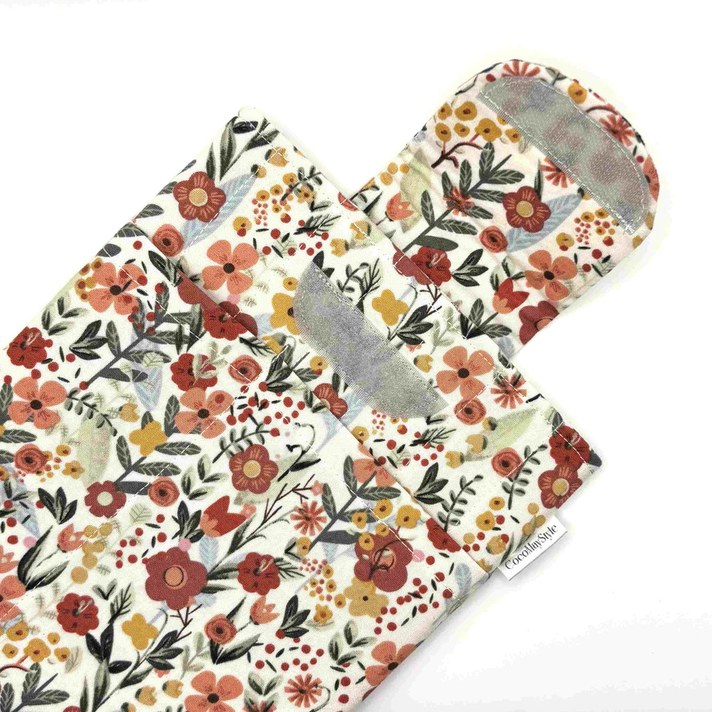 E-Reader sleeve with floral patterned fabric showing open velcro flap