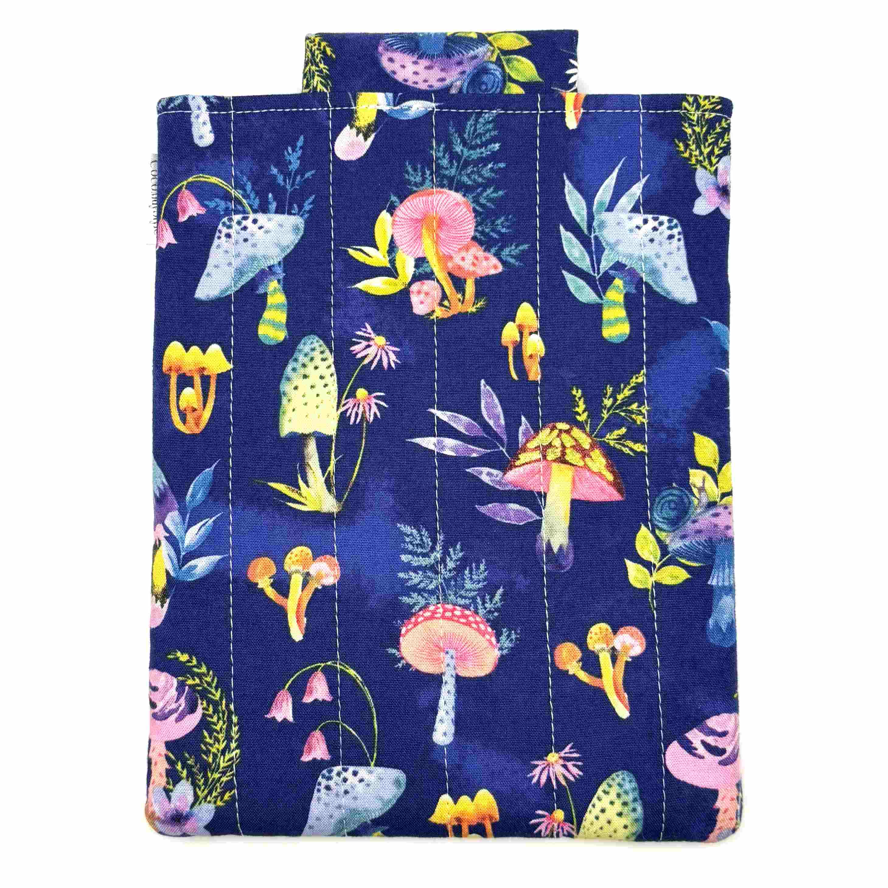 E-Reader sleeve with mushroom and foliage design on a blue background