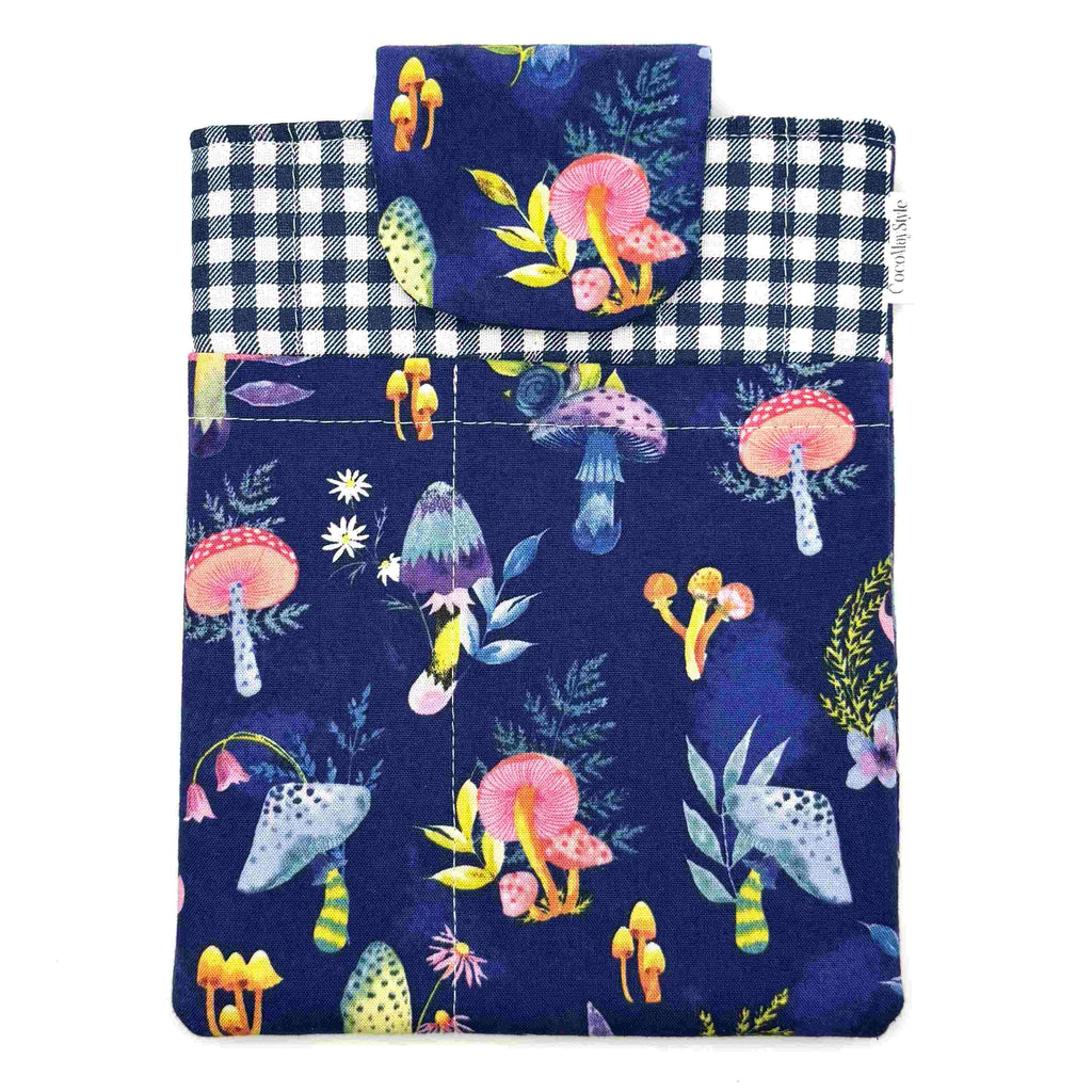 E-Reader sleeve with mushroom and foliage design on a blue background