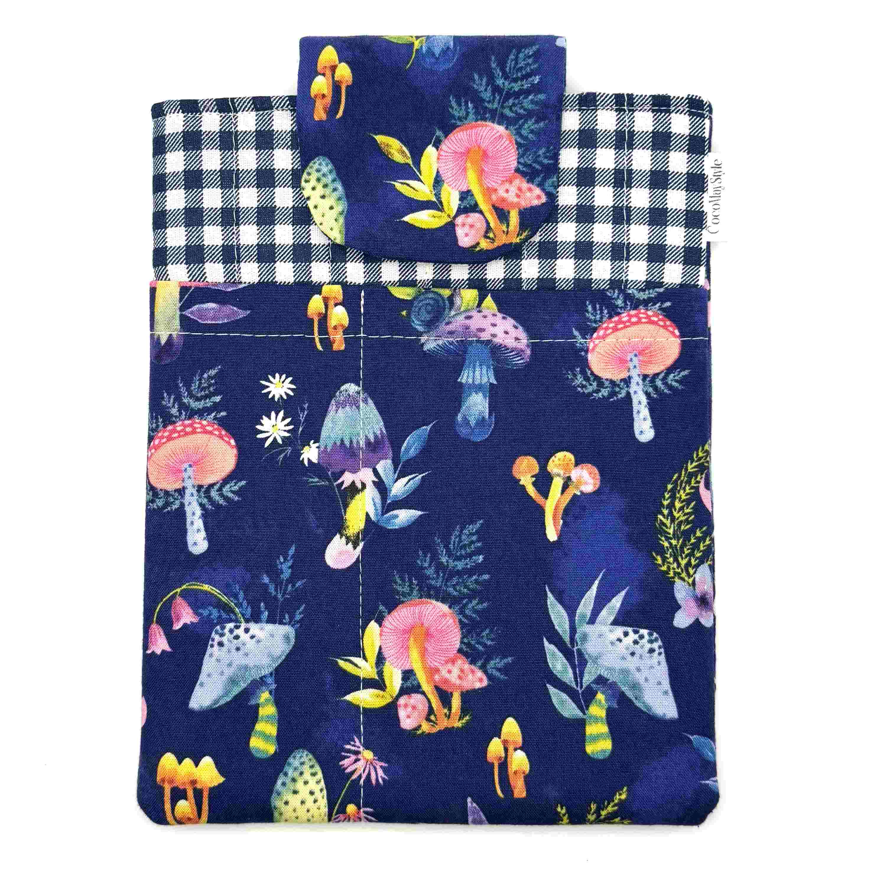 E-Reader sleeve with mushroom and foliage design on a blue background