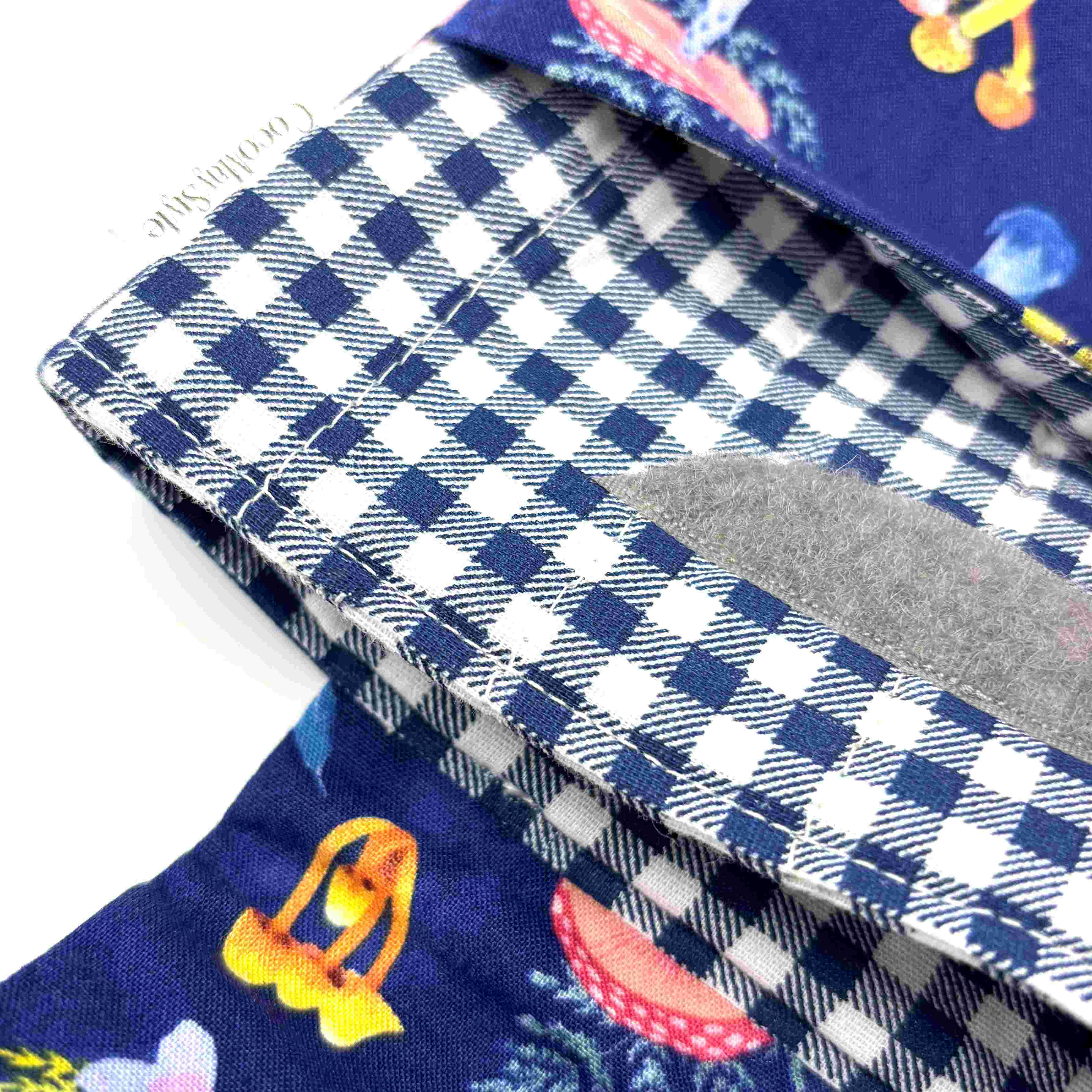 Close-up of e-Reader sleeve with mushroom and foliage design on a blue background