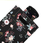 E-Reader sleeve with pink florals on a black background showing open velcro flap