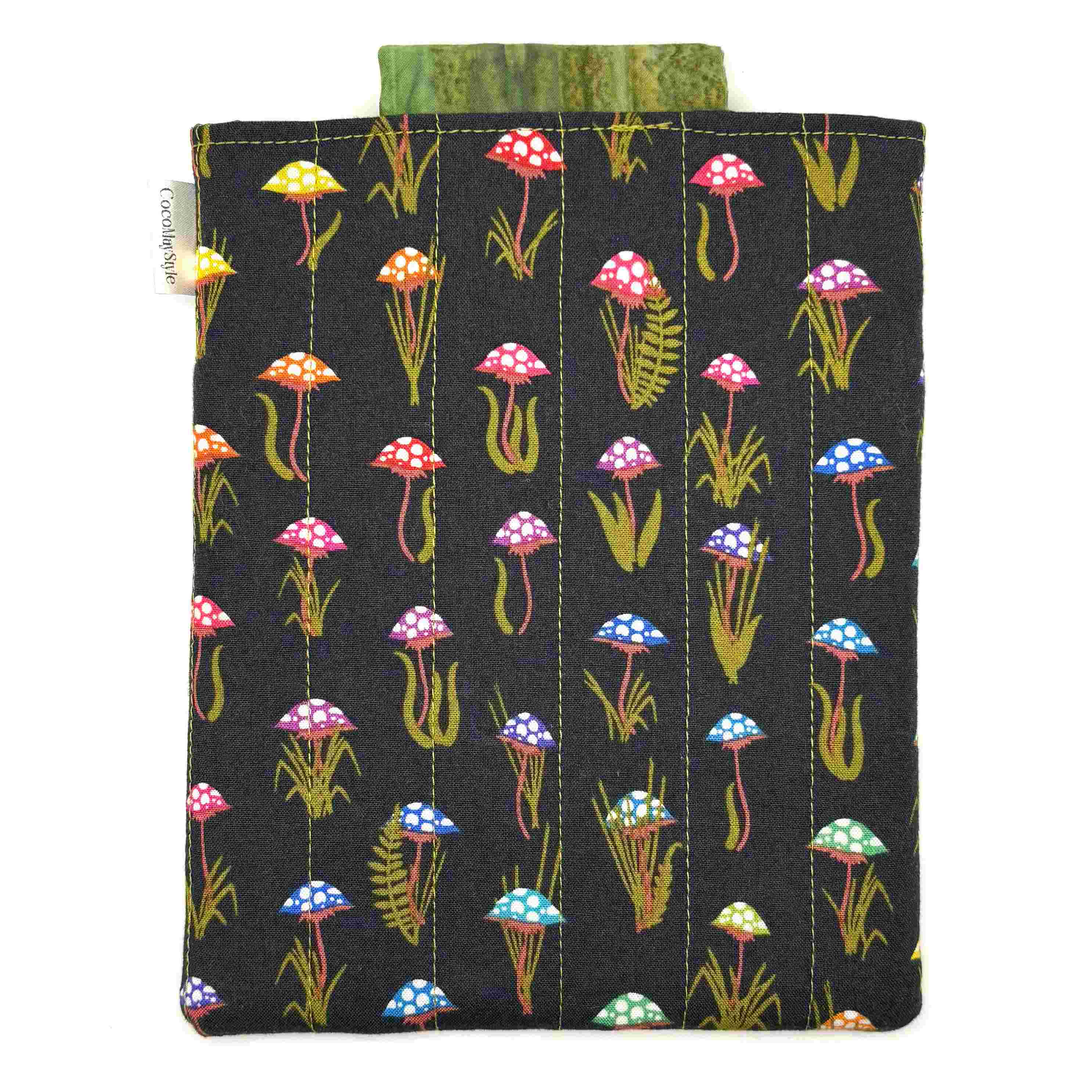 E-Reader sleeve with mushroom and foliage design on a black background