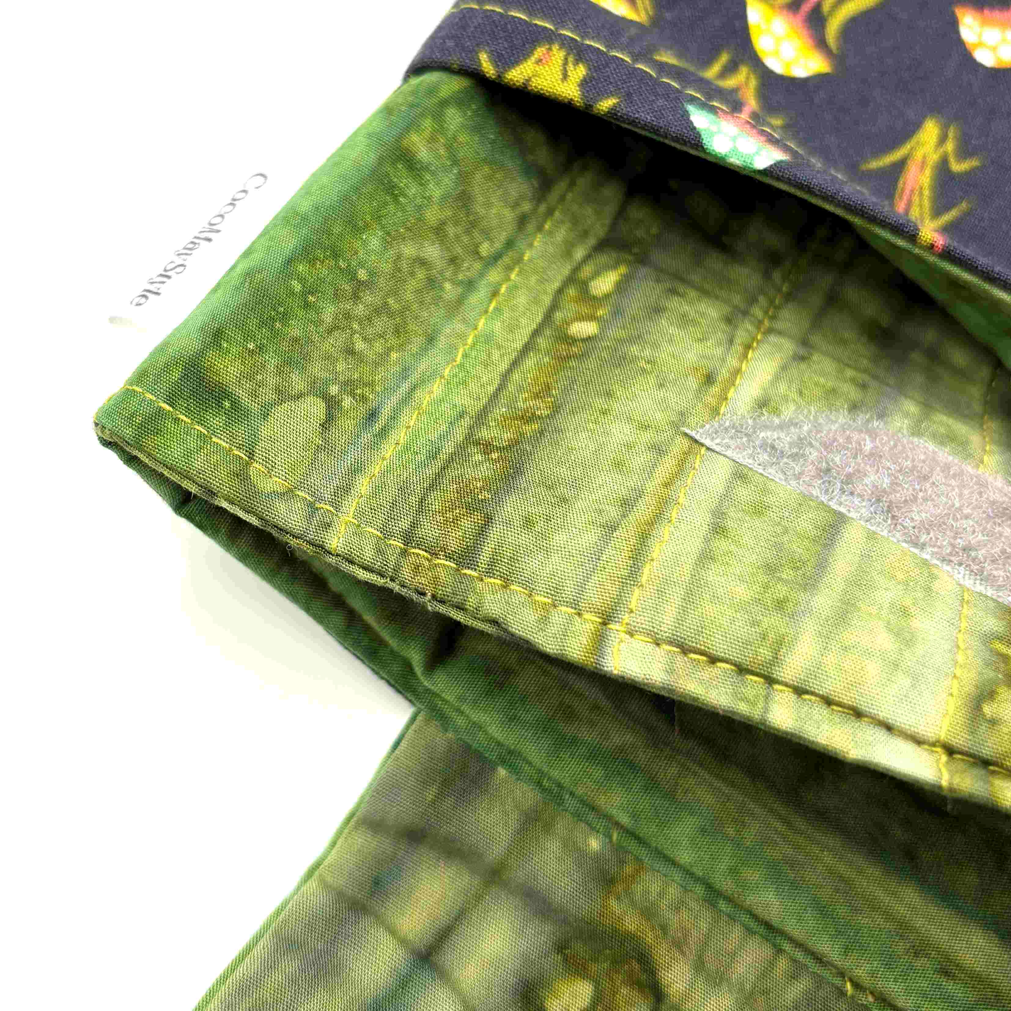 Close-up of e-Reader sleeve with mushroom and foliage design on a black background