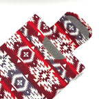E-Reader sleeve with red and white patterned fabric with geometric design showing open velcro flap