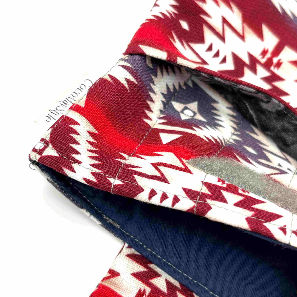 Close-up of e-Reader sleeve with red and white patterned fabric with geometric design