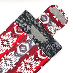 E-Reader sleeve with red and white patterned fabric with geometric design showing open velcro flap
