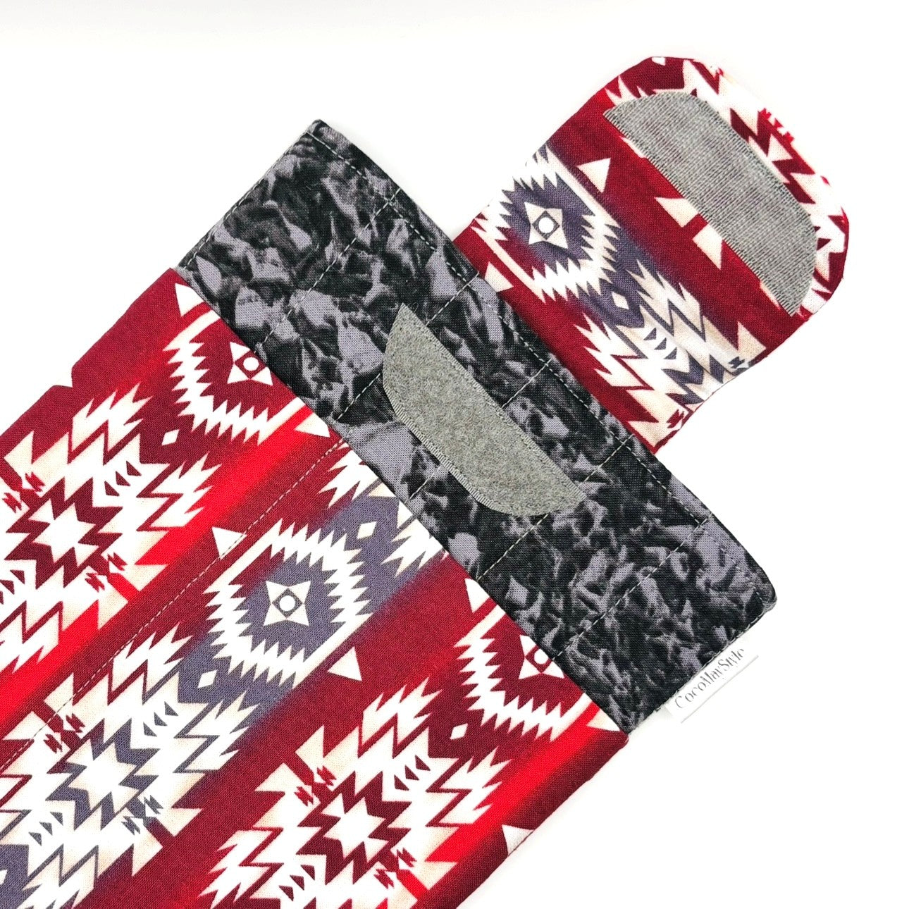 E-Reader sleeve with red and white patterned fabric with geometric design showing open velcro flap