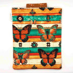 E-Reader sleeve with butterfly design on a striped background