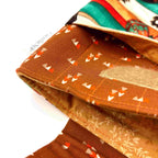 Close-up of e-Reader sleeve with butterfly design on a striped background