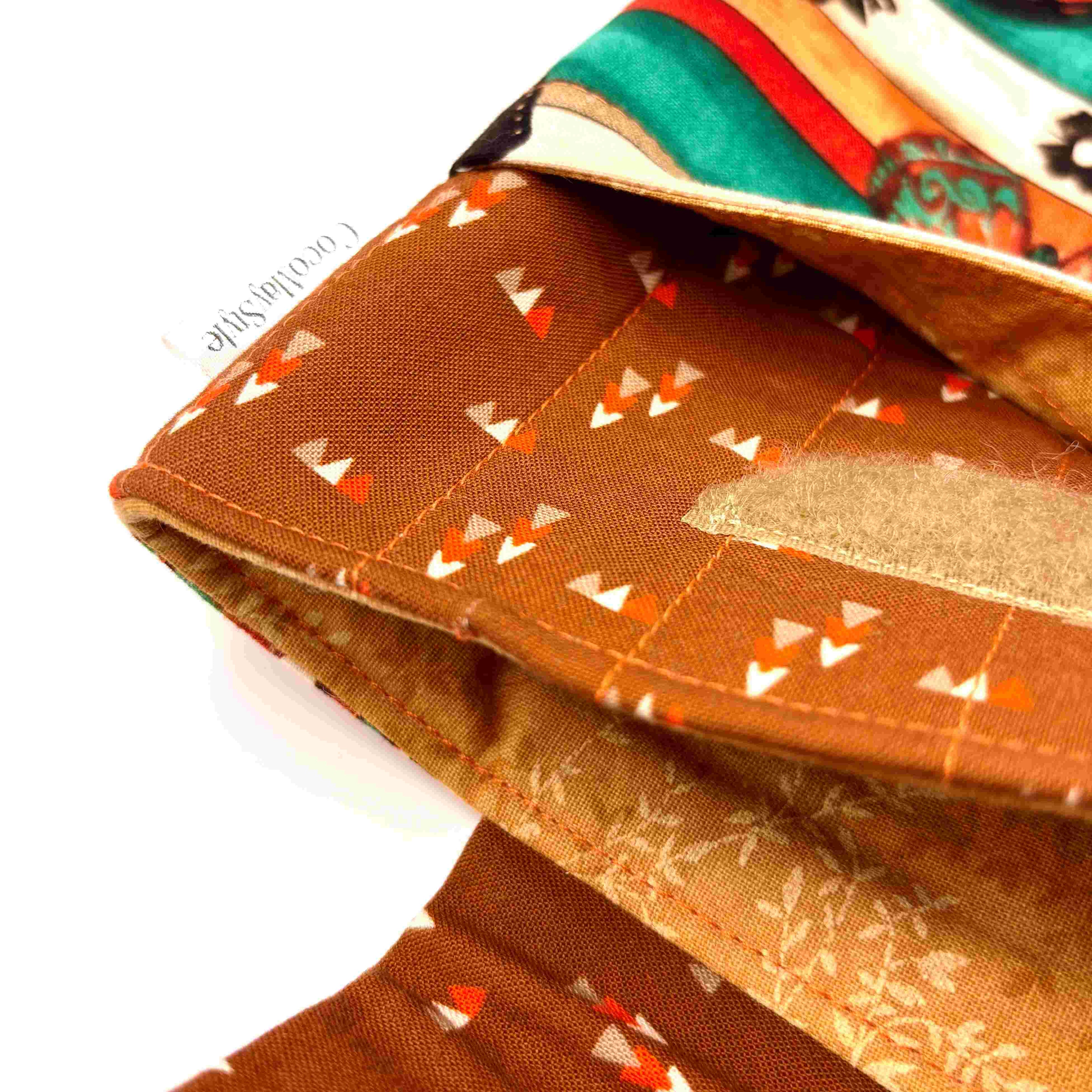 Close-up of e-Reader sleeve with butterfly design on a striped background