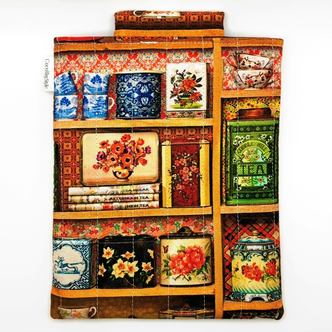 E-Reader sleeve with colorful tea tins displayed on a shelf pattern