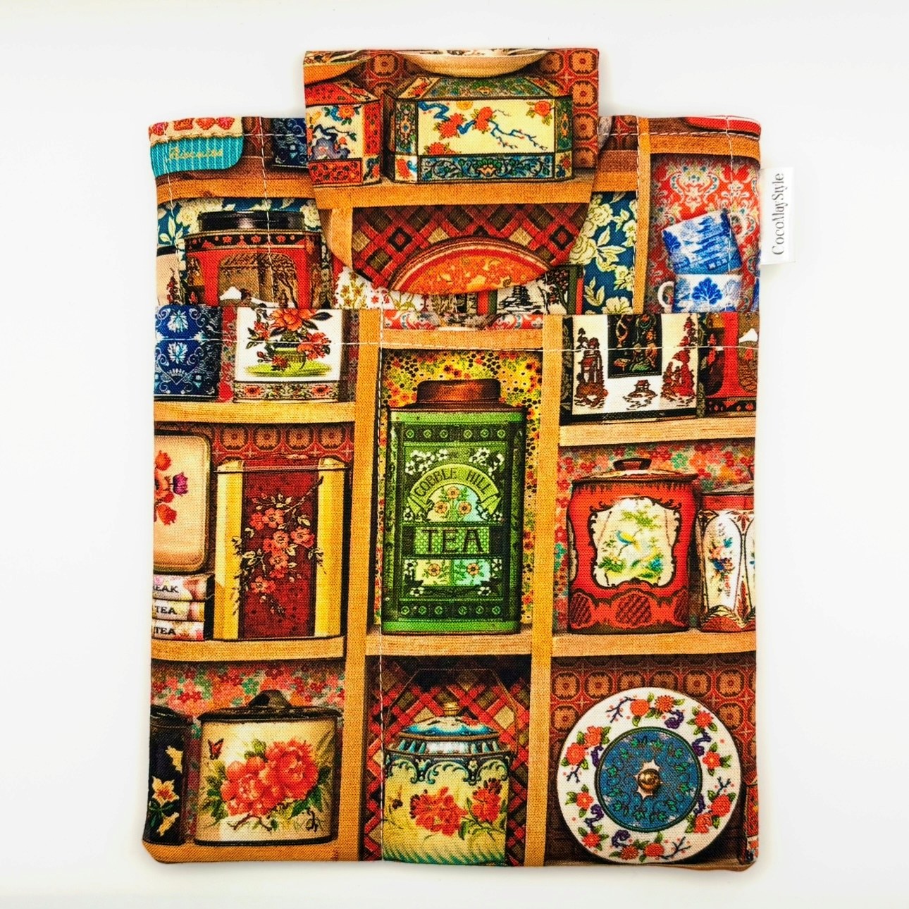 E-Reader sleeve with colorful tea tins displayed on a shelf pattern