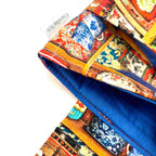 Close-up of e-Reader sleeve with colorful tea tins displayed on a shelf pattern