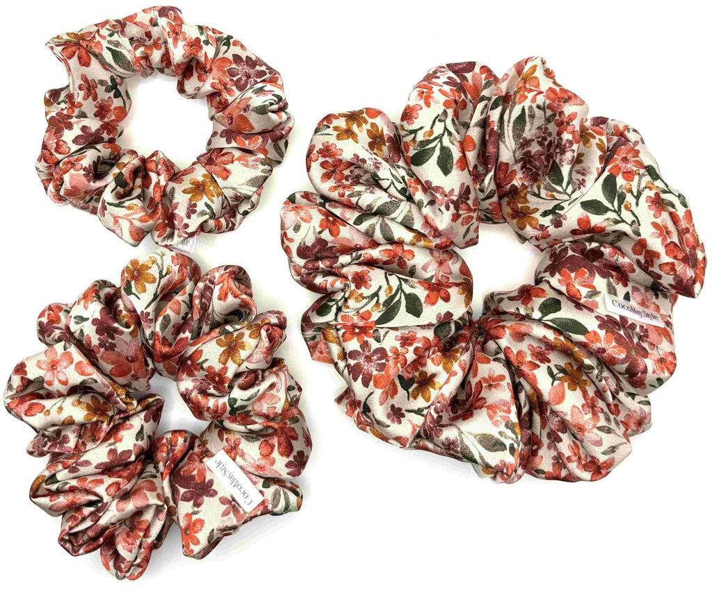 Floral satin scrunchies on a white background