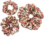 Floral satin scrunchies on a white background