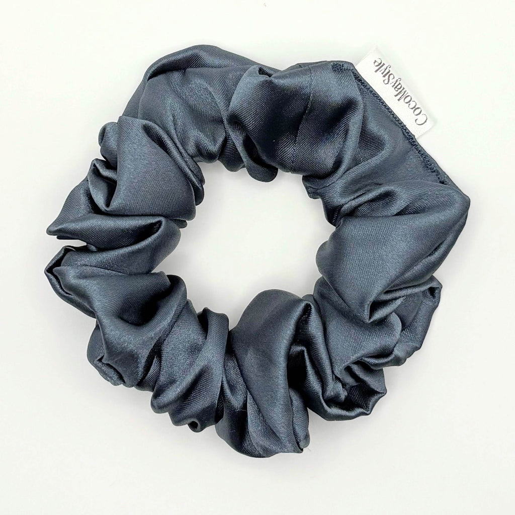 Blue satin scrunchie on a white background