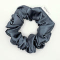 Blue satin scrunchie on a white background