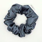 Blue satin scrunchie on a white background
