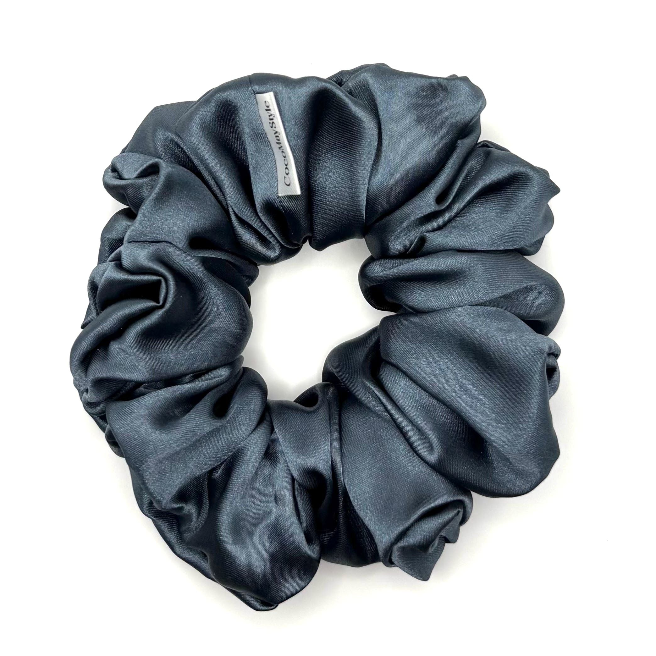 Blue satin scrunchie on a white background