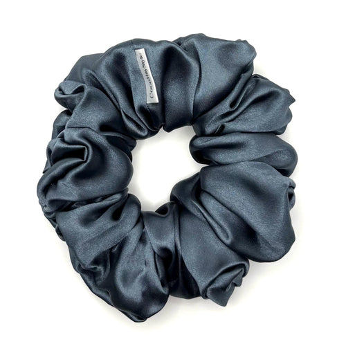 Blue satin scrunchie on a white background