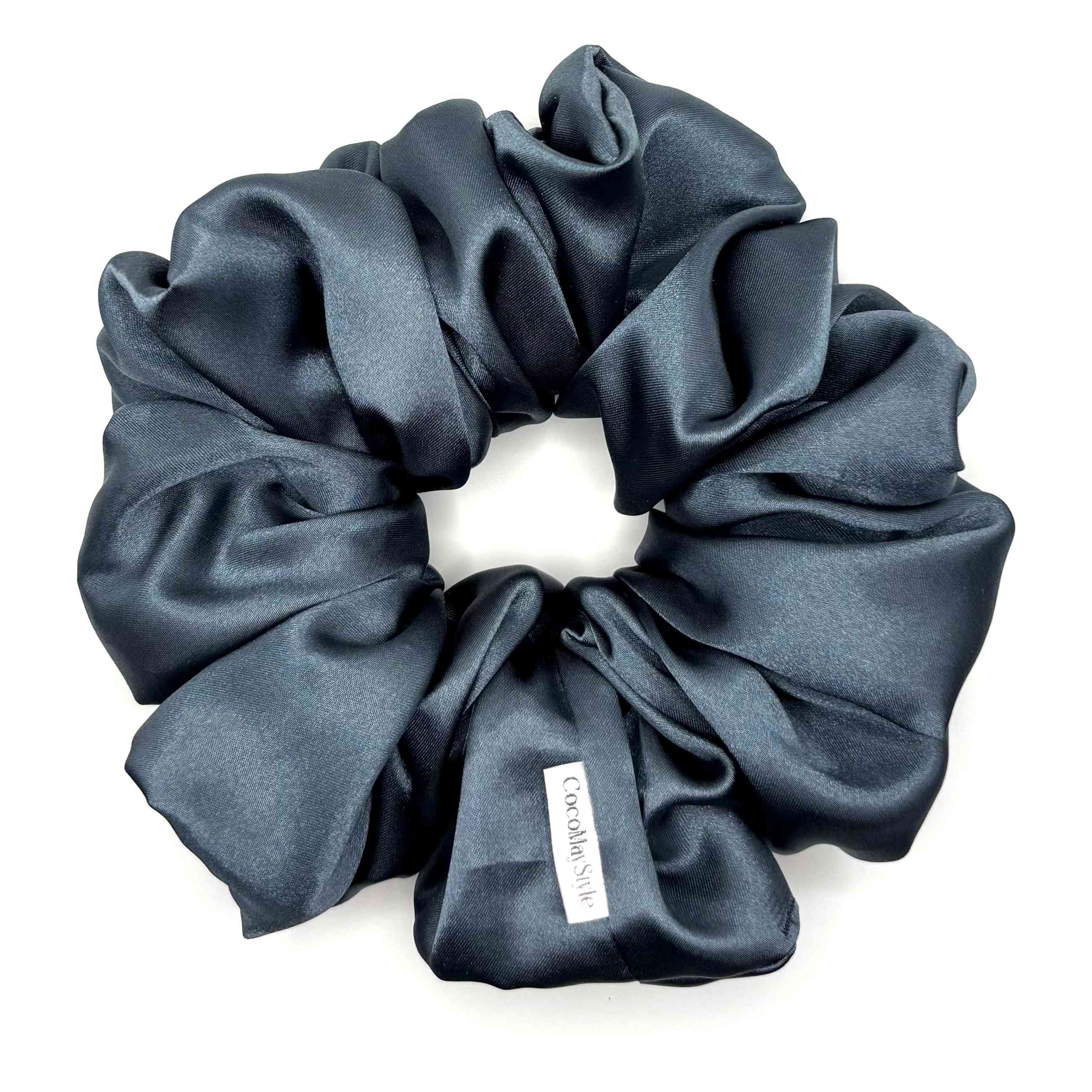 Blue satin scrunchie on a white background