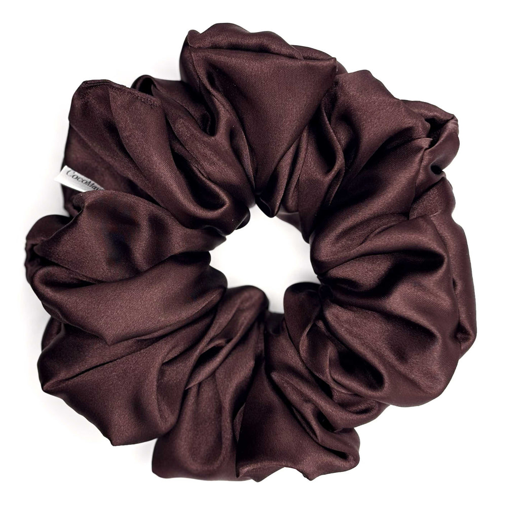 Brown satin scrunchie on a white background