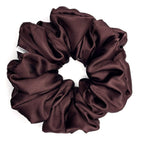 Brown satin scrunchie on a white background