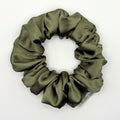 Olive green satin scrunchie on a white background