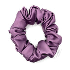 Purple satin scrunchie on a white background