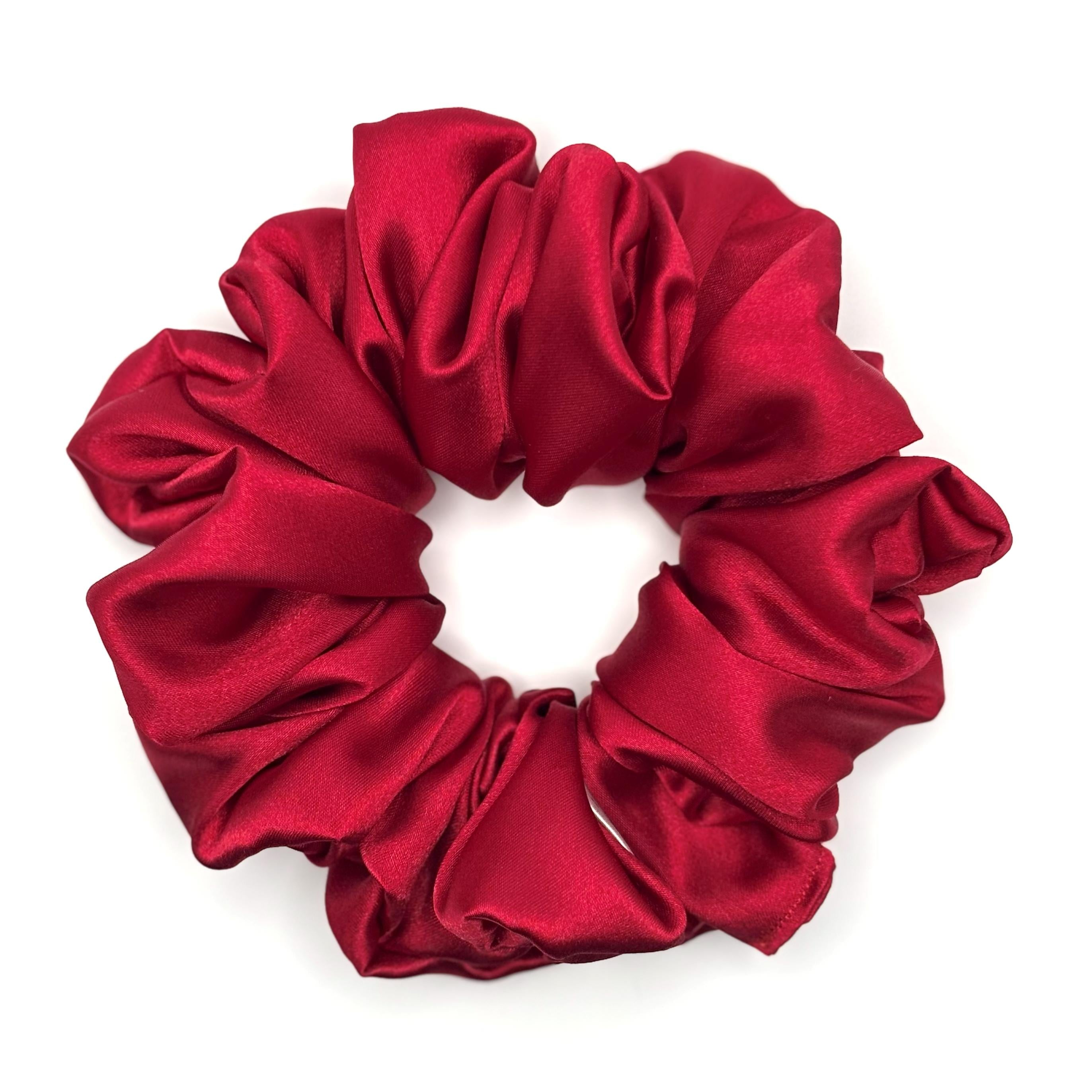 Red satin scrunchie on a white background