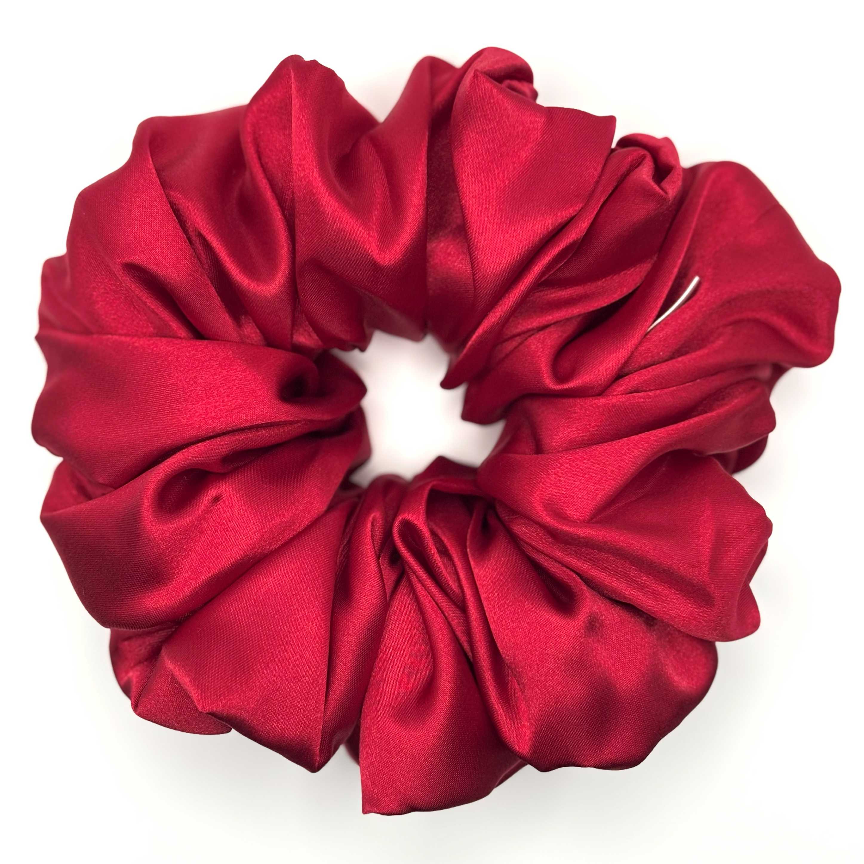 Red satin scrunchie on a white background