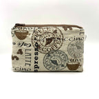 Zipper pouch with coffee words and graphics on a tan brown background
