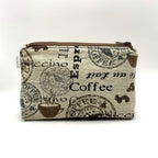 Zipper pouch with coffee words and graphics on a tan brown background