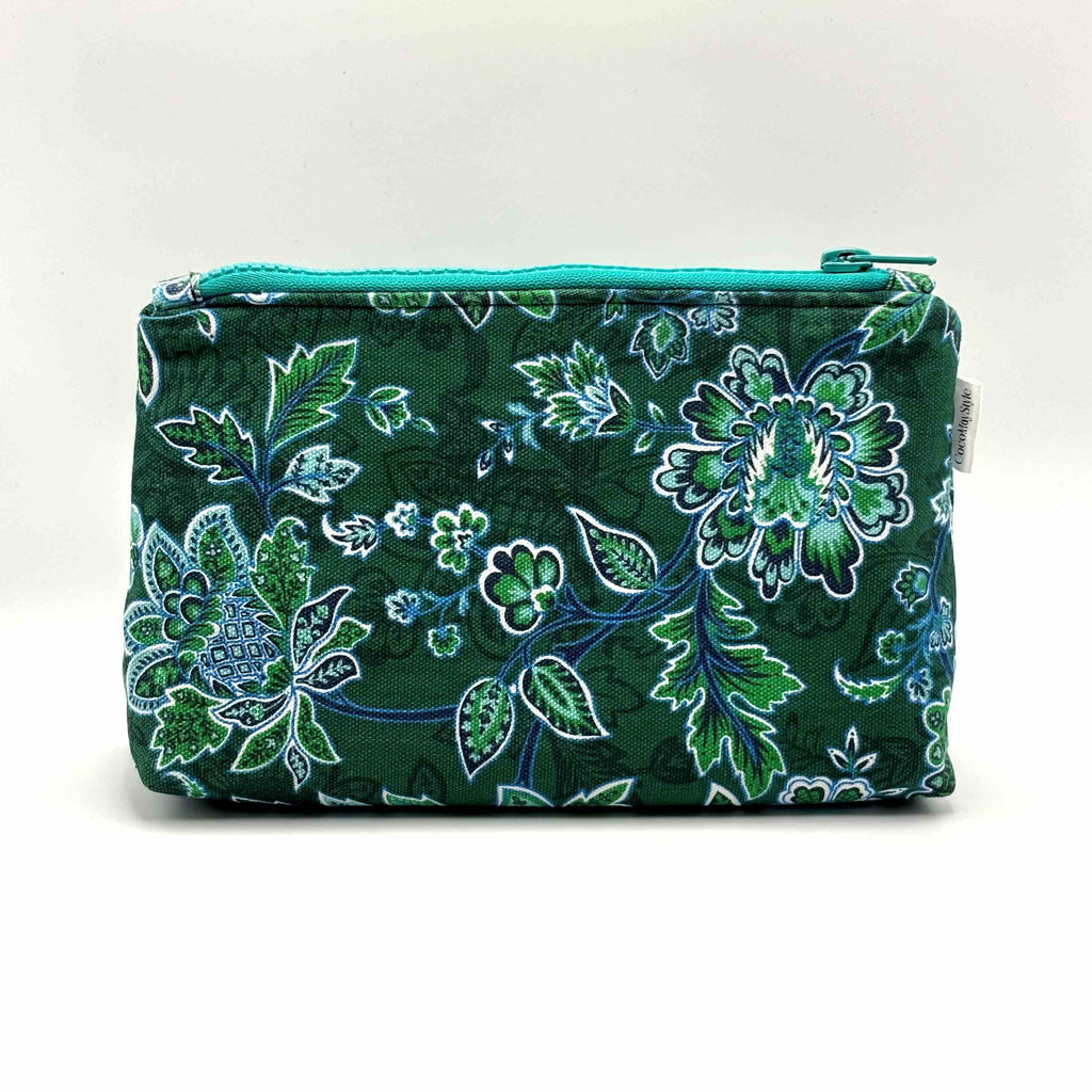 Zipper pouch with green floral pattern on a dark green background