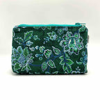Zipper pouch with green floral pattern on a dark green background