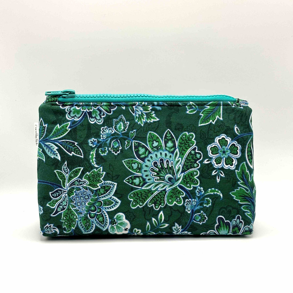 Zipper pouch with green floral pattern on a dark green background